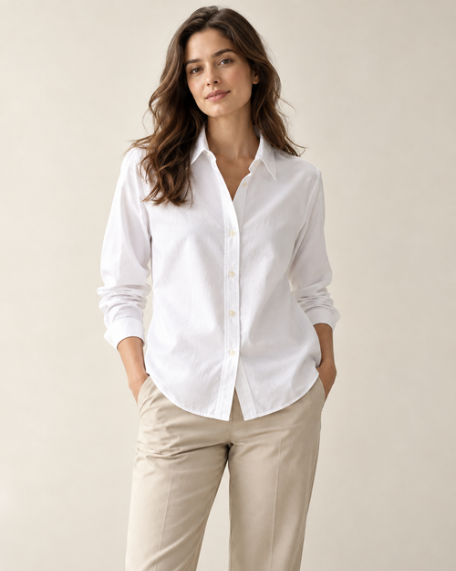 Woman wearing Maison Aria classic button-front shirt in white