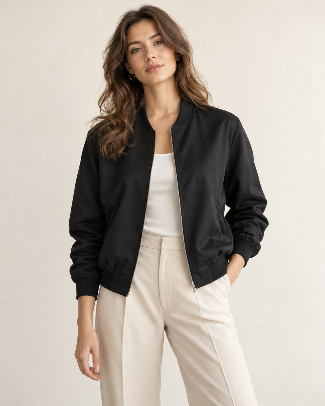 Woman wearing Maison Aria minimal bomber jacket in black