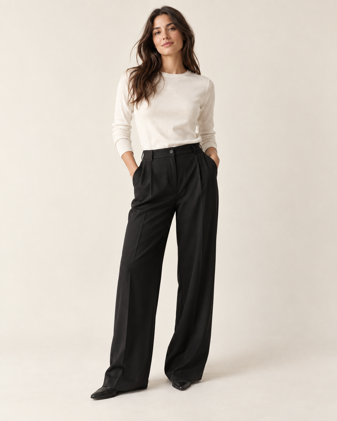 Woman wearing Maison Aria relaxed-fit trousers in black