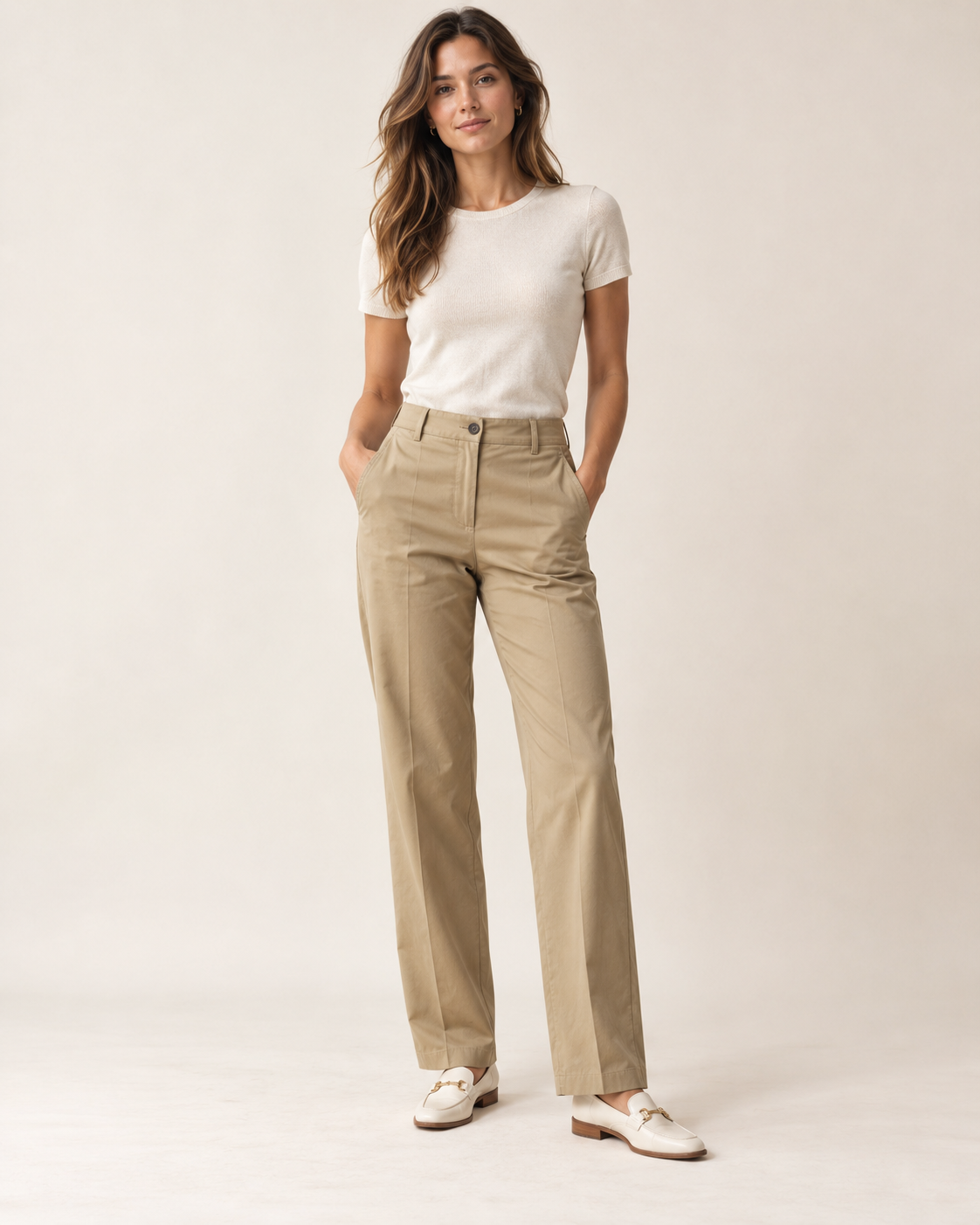 Woman wearing Maison Aria tailored chino trousers in sand